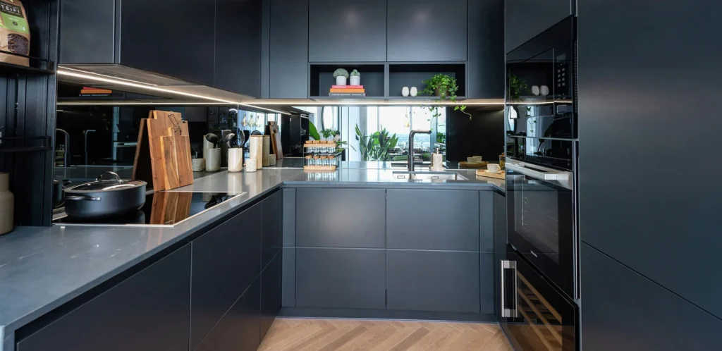 Berkeley Group - Dark modern kitchen with complimentary worktop.
